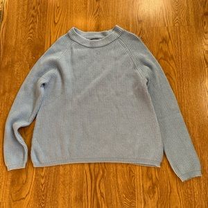 Light blue sweater.